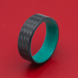 Carbon Fiber Ring with Teal Glow Sleeve