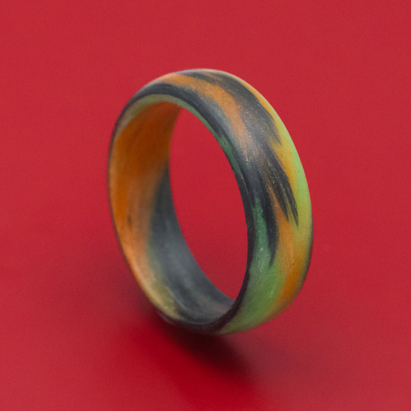 Carbon Fiber Ring with Orange and Green Glow Marbled Design