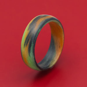 Carbon Fiber Ring with Orange and Green Glow Marbled Design
